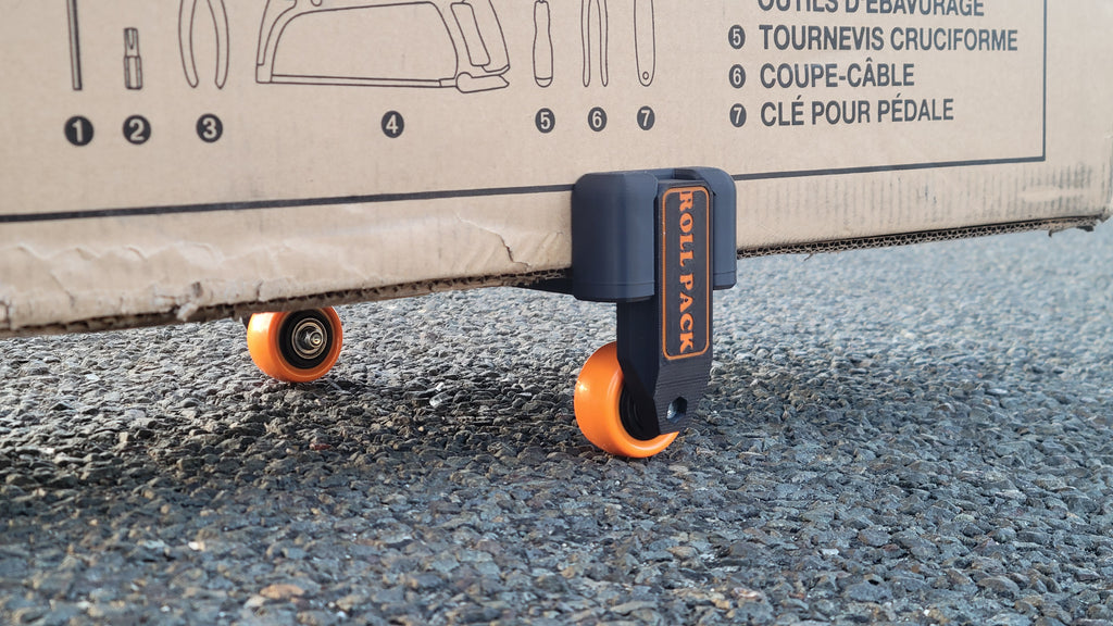 Roll Pack turns any cardboard box into a smooth rolling travel case.