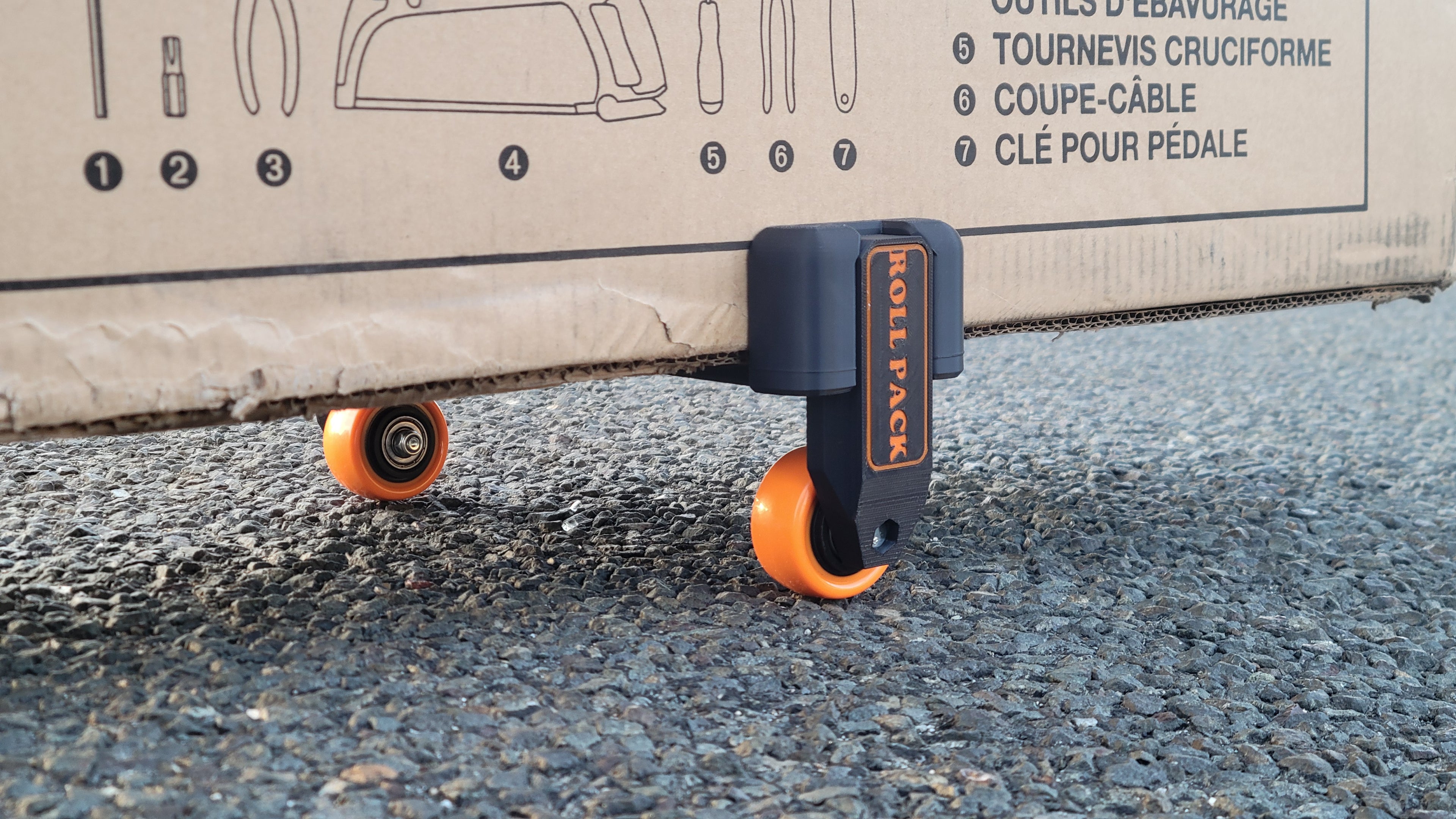 Roll Pack turns any cardboard box into a smooth rolling travel case.